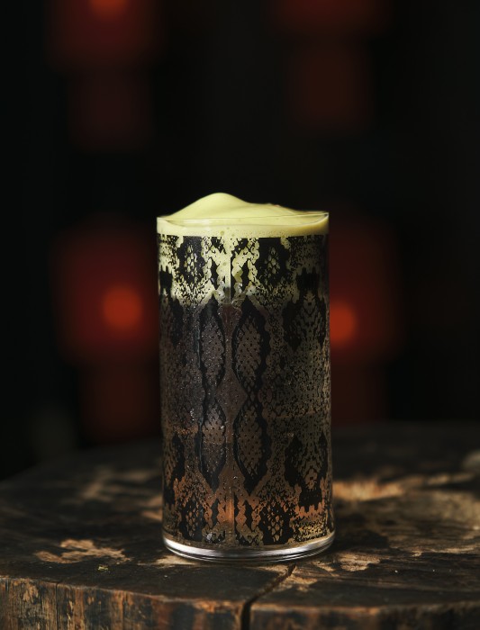 The Cocktails

Lantern of the Bride – inspired by the spirit of a wronged bride whose death unleashes a vengeful phantom. This cocktail is a blood-red whisper of rum and artichoke liqueur, laced with orange bitters and a sting of chilli.
Leifeng Pagoda – a tribute to the legend of the White Snake, whose forbidden love for a mortal defied the heavens and ultimately ended in tragedy. A tall, shimmering drink that evokes the pagoda’s layers, the waters of West Lake, and the duality of the White Snake herself.
Nine Tales – the story of a nine-tailed fox demon who learns the cost of love. Seductive and sweet at first, with a fiery, bittersweet finish – an echo of her passion and sacrifice.
